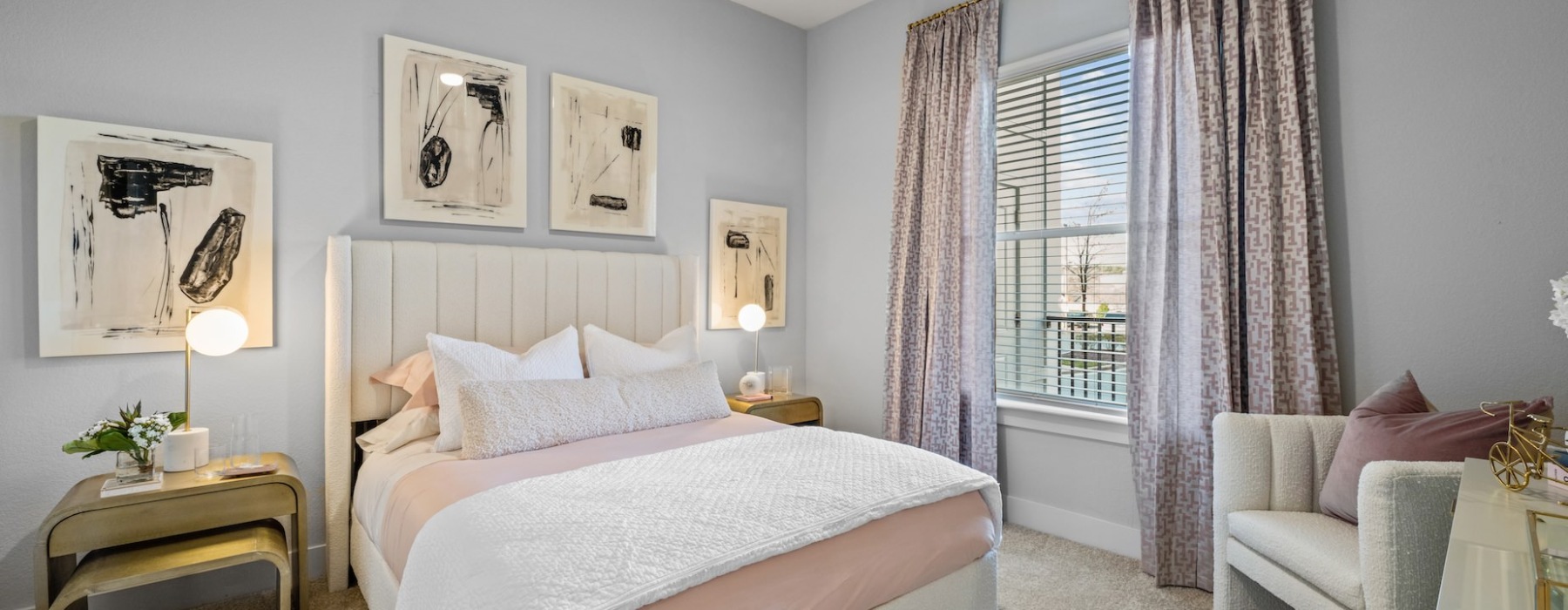 Bedroom with large bed, ensuite. queen bed and nightstands.